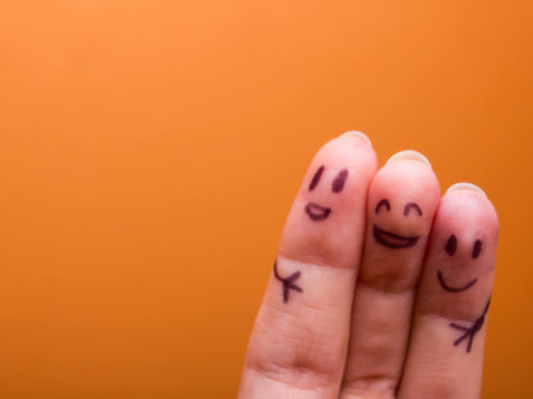 three smiling fingers that are very happy to be friends, family concept